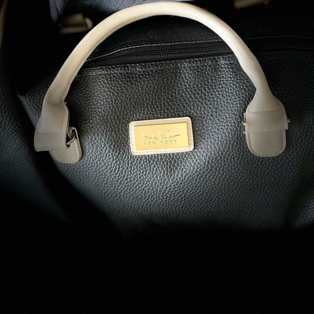 Nicole Miller classic Black and Tan Weekender. Very good condition.